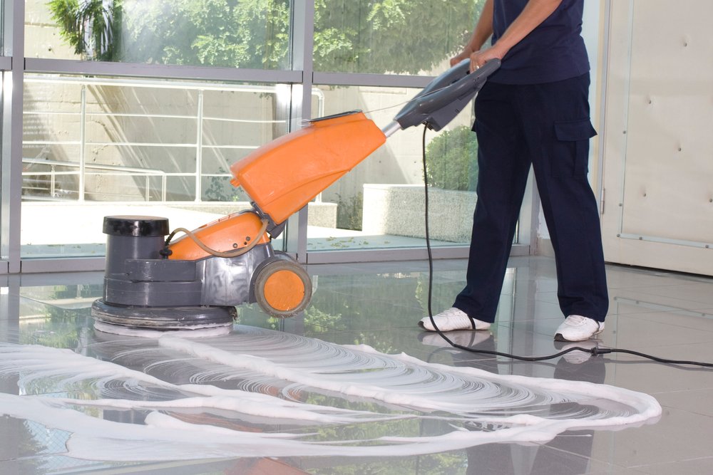 Cleaning the floor with machine